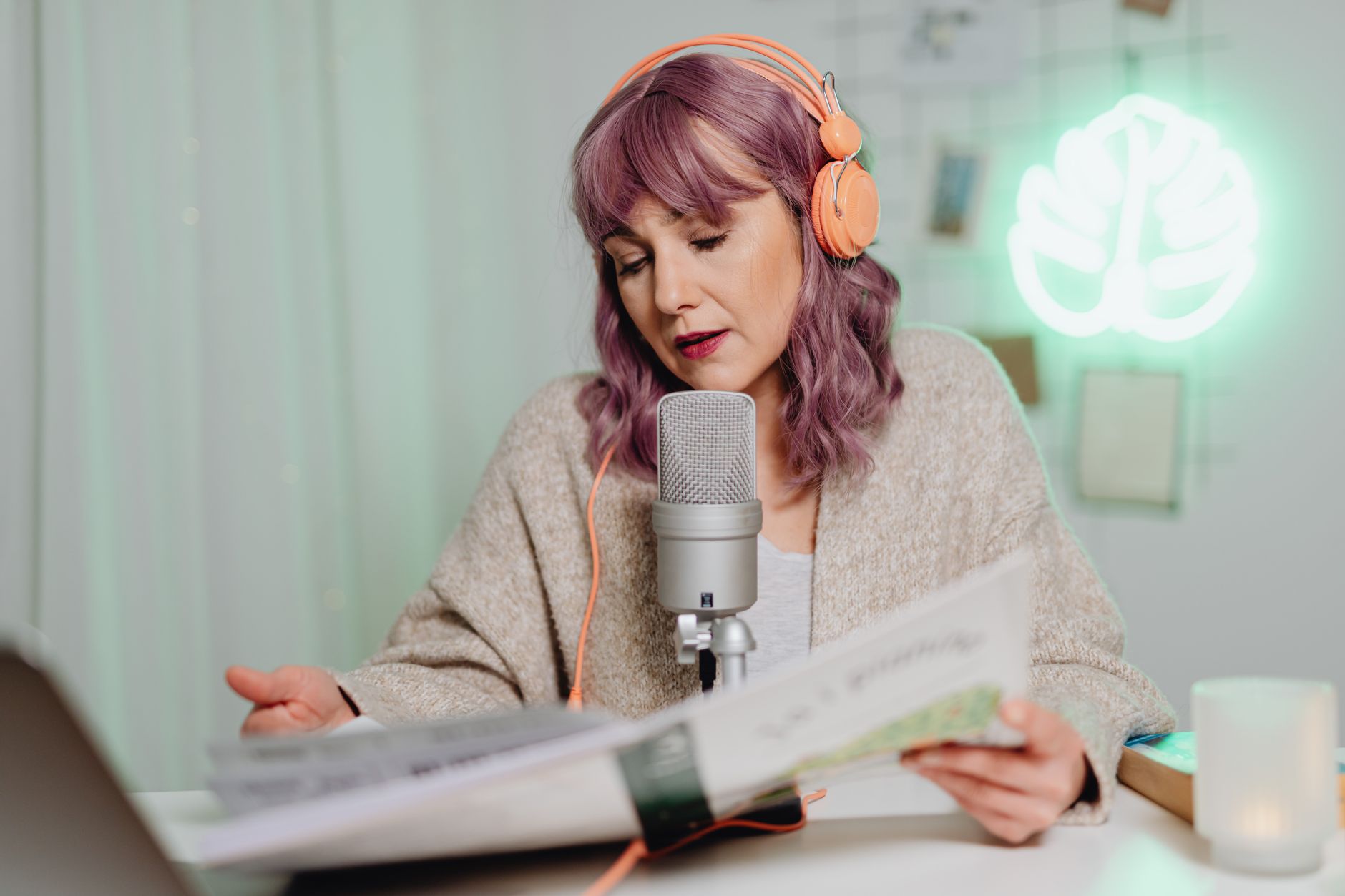 Young woman listening to a podcast, reflecting UK podcast trends 2026